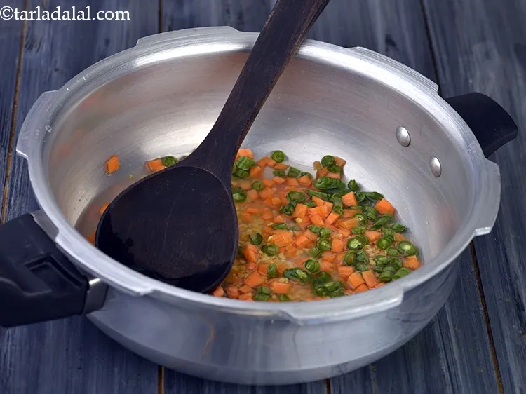 Step 23 – Mix well with the help of a ladle.&nbsp; &nbsp;