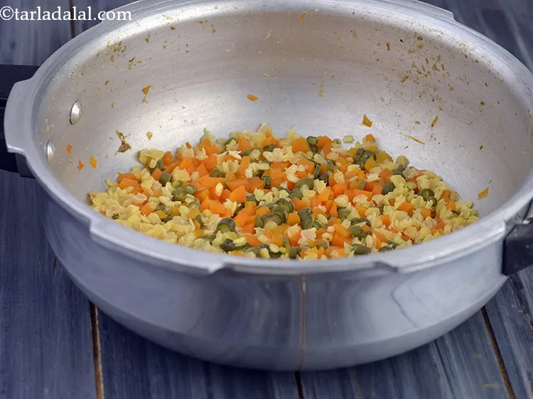 Step 25 – Open the lid. This is how cooked mixture for <strong>Mashed Vegetable Mixed Dal for Babies</strong> …
