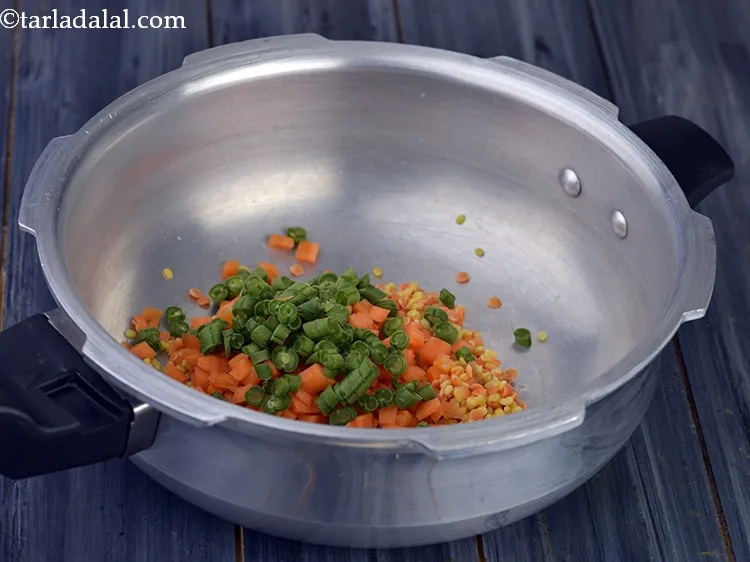 Step 21 – <div> Add finely chopped French beans to it. You can use other vegetables like cauliflower …