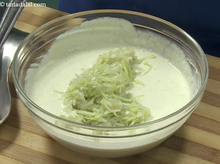 Step 13 – Add bottle gourd to the fermented batter. You can add any veggies of your choice …