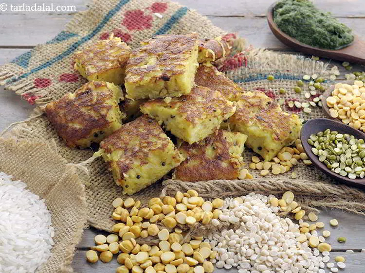 Step 35 – Serve the&nbsp;<strong>mixed dal handvo | Gujarati handvo |</strong>&nbsp;immediately. You can enjoy the vegetable lentil cake …