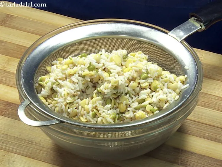Step 8 – Drain the dals, rice and whole wheat using a strainer.