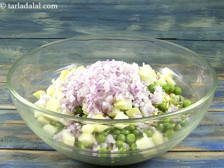 Step 31 – Add finely chopped onions. Jains can skip onions, potatoes and chilli garlic chutney.