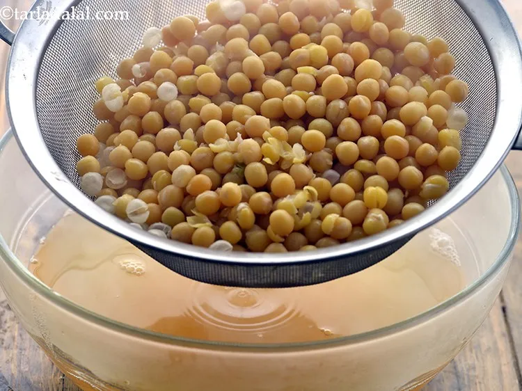Step 10 – Drain the soaked and boiled safed vatana using a strainer and keep aside.