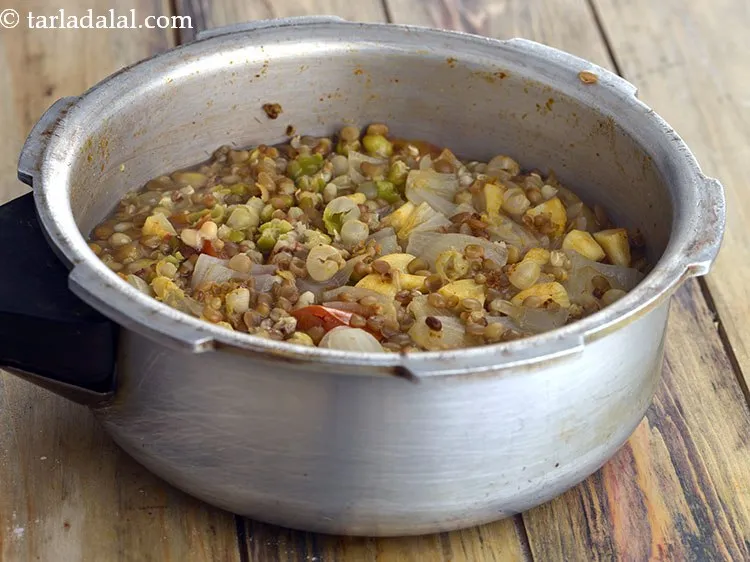 Step 8 – Mix well and pressure cook for 3 whistles. Allow the steam to escape before opening …