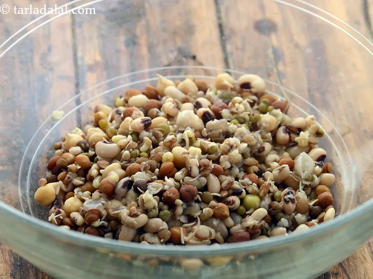 Step 3 – For making<strong> mixed sprouts bhel</strong>, in a deep bowl take 1 cup boiled mixed sprouts.&nbsp;