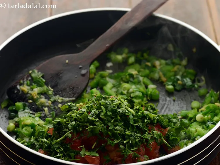 Step 19 – Add coriander. It will add a refreshing taste to our<strong> healthy sprouts pulao</strong>.&nbsp;