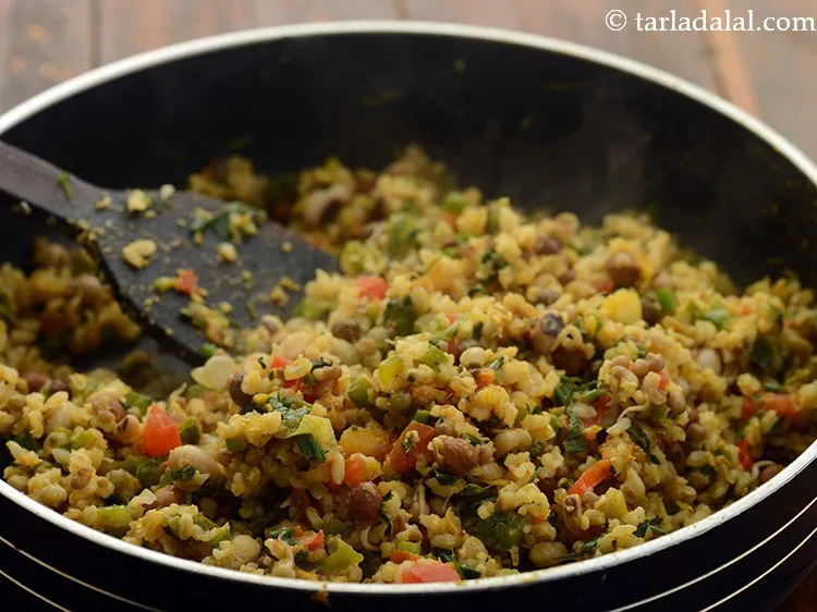 Step 26 – Mix well and cook <strong>mixed sprouts with brown rice </strong>on medium flame for 2 minutes, …