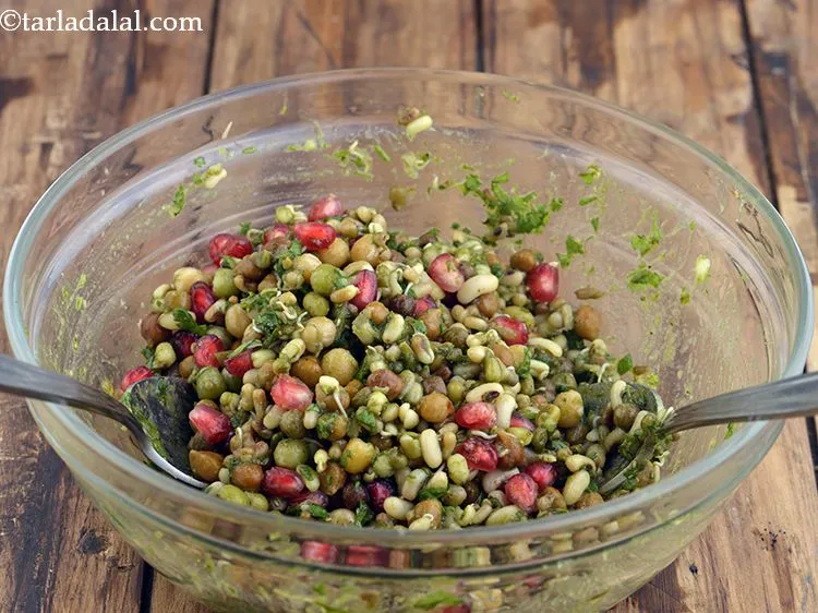 Step 12 – Mix well and our <strong>mixed sprouts chaat</strong> is ready!