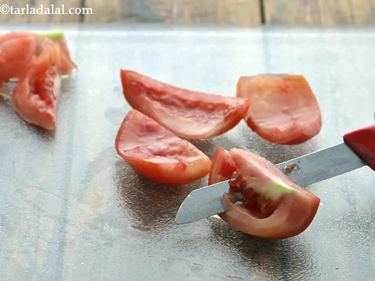 Step 31 – Remove the center white portion and the seeds of the tomatoes using the same knife …