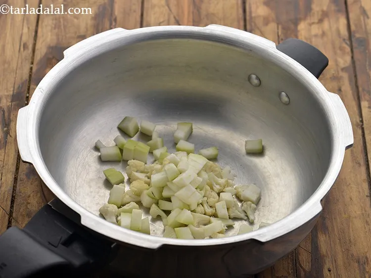 Step 34 – Add the chopped bottle gourd. This vegetable gives considerable amounts of water.&nbsp;