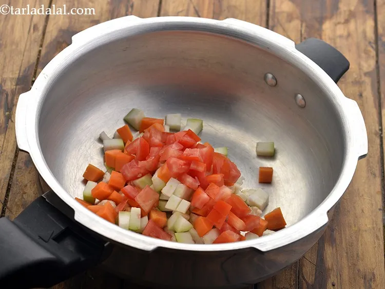 Step 36 – Finally add the last vegetable &ndash; chopped tomatoes. We have used 4 different vegetables in …