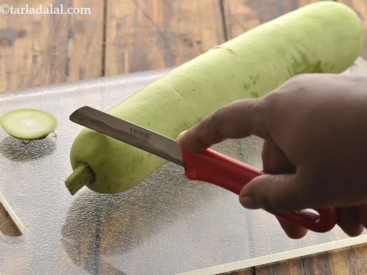 Step 17 – Trim both the edges of the bottle gourd.&nbsp;