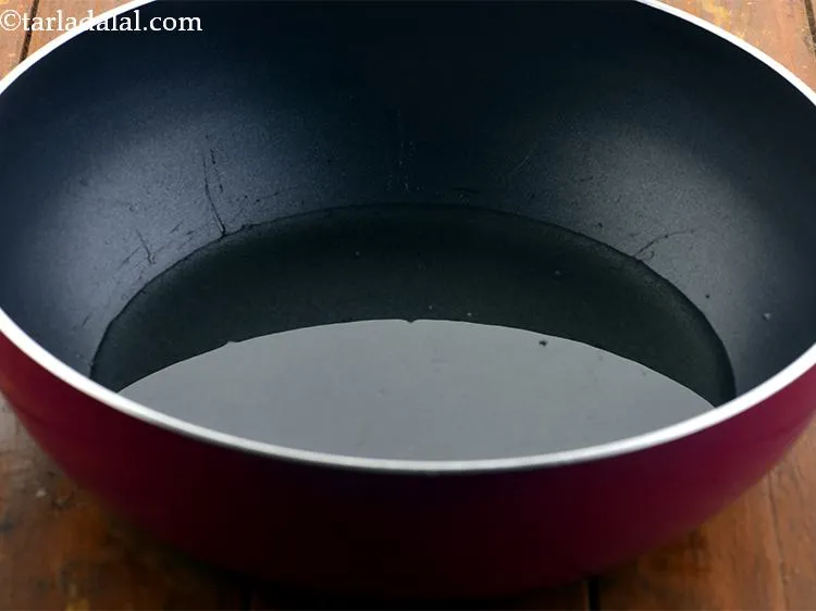Step 12 – Heat the oil in a deep non-stick pan. It may seem like a lot of …