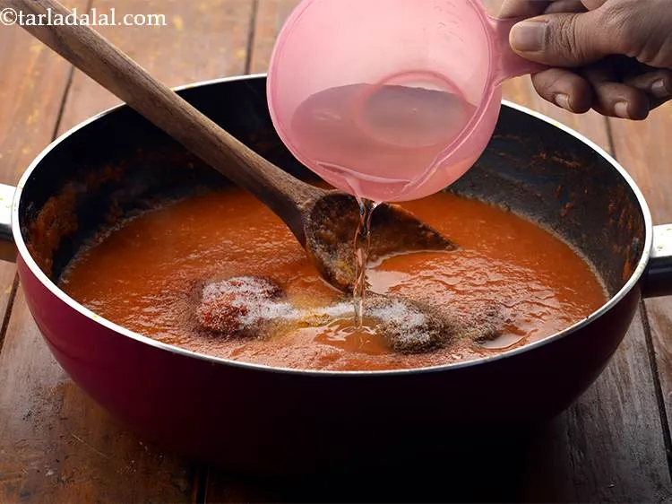 Step 29 – Finally add &frac12; cup of water to make the gravy less thick.