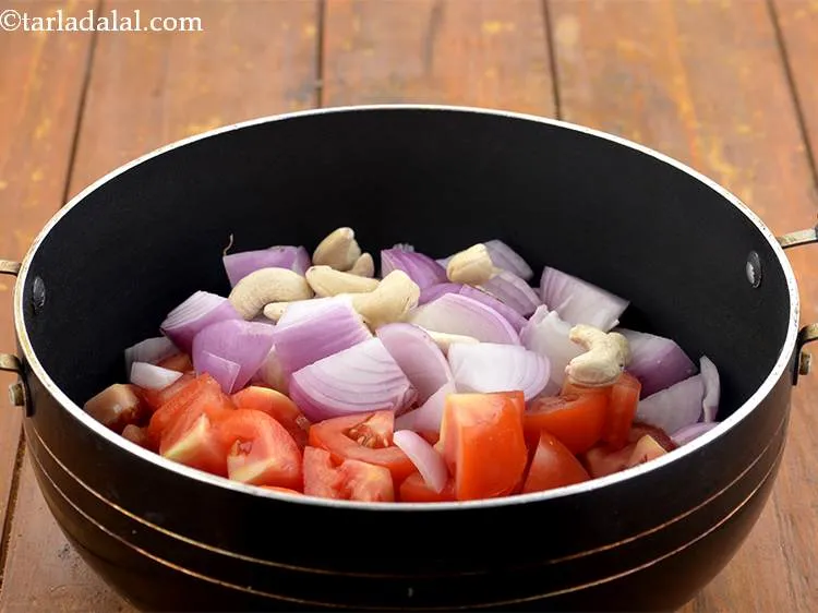 Step 4 – Now add the cashews. The cashews give a rich gravy.