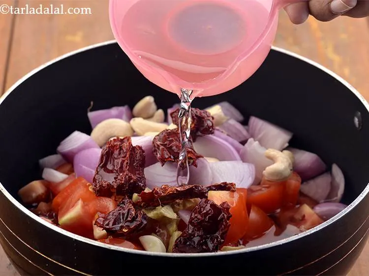Step 8 – Now add 2 cups of water to the vegetables.