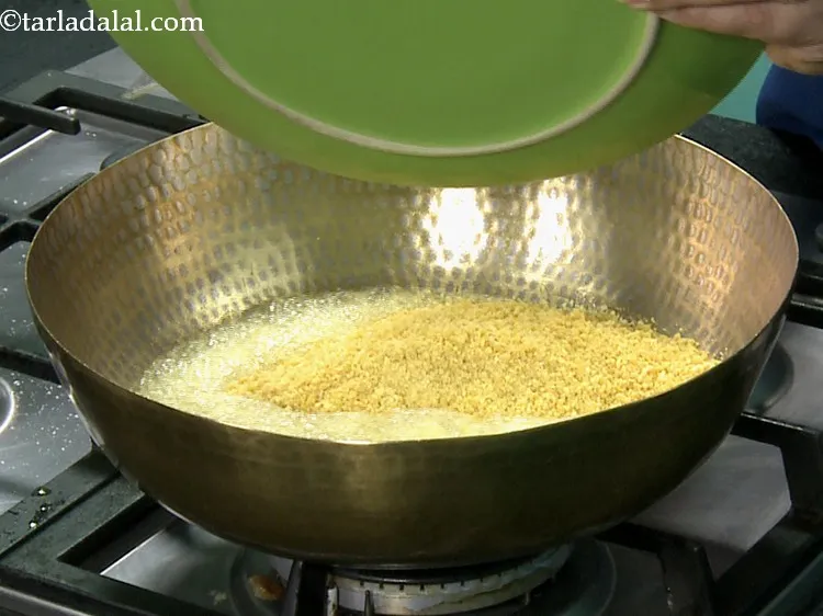 Step 14 – Add the sieved besan mixture.