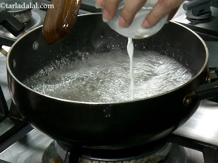 Step 20 – Lower the flame to slow, when it boils, add 2 tsp of milk. This is …