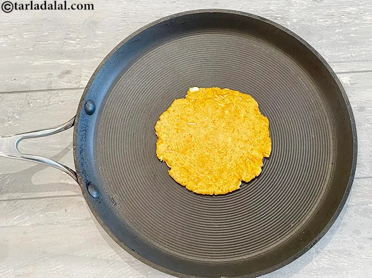 Step 23 – Flip and cook the other side of the roti.