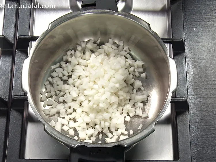 Step 21 – For pressure cooking <strong>mooli moong dal</strong>, add <span style="font-family:Arial,sans-serif"><span style="background-color:#ffffff; font-size:14.6667px">1&nbsp;</span></span>cup&nbsp;<a href="https://www.tarladalal.com/glossary-chopped-radish-807i">chopped white radish</a>&nbsp;, washed …