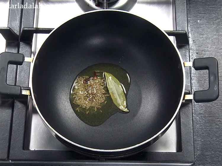 Step 31 – Add 2&nbsp;<a href="https://www.tarladalal.com/glossary-cloves-322i">cloves (laung / lavang)</a>.