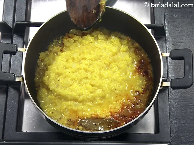 Step 37 – Add the cooked mooli-moong dal mixture.