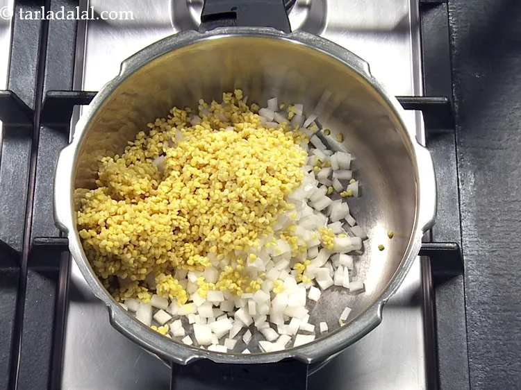 Step 22 – Add washed and drained moong dal.
