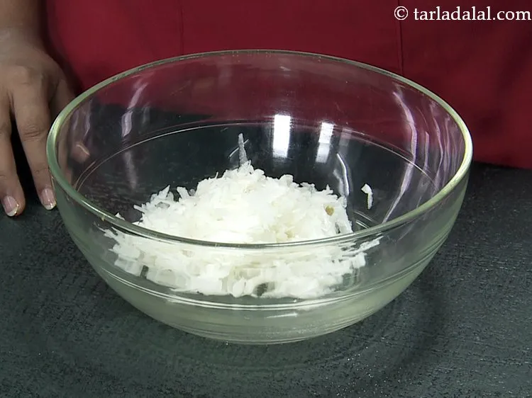 Step 4 – Transfer the grated mooli in a deep bowl. Other vegetables like grated lauki, cabbage, carrot …
