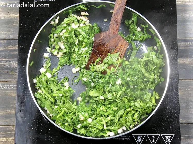 Step 12 – Saut&eacute; on a medium flame for 1 minute or until the leaves are wilted.