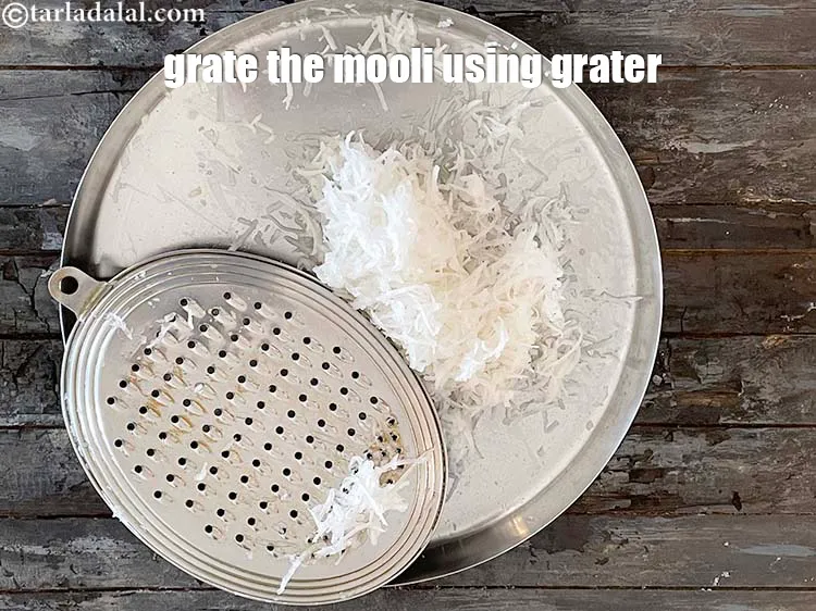 Step 7 – <meta charset="UTF-8" />To grate by hand, hold grater in one hand and the radish in …