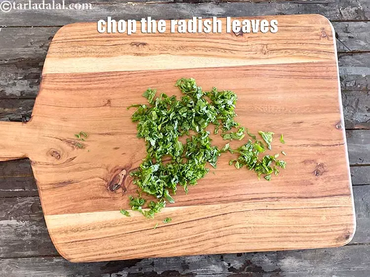 Step 13 – Chop the radish leaves on a chopping board.