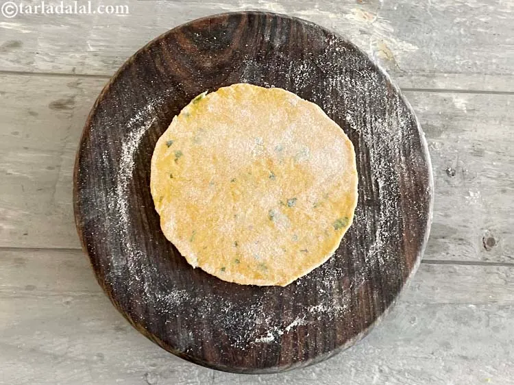 Step 26 – Roll out each portion into a 125 mm. (5&quot;) diameter circle using a little whole …