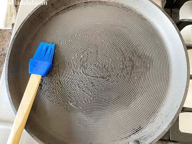 Step 27 – Heat a non-stick tava (griddle) and grease with a little oil.