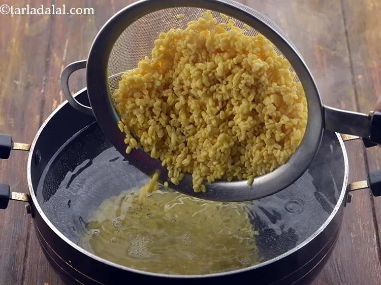 Step 14 – Add the soaked and drained yellow moong dal.