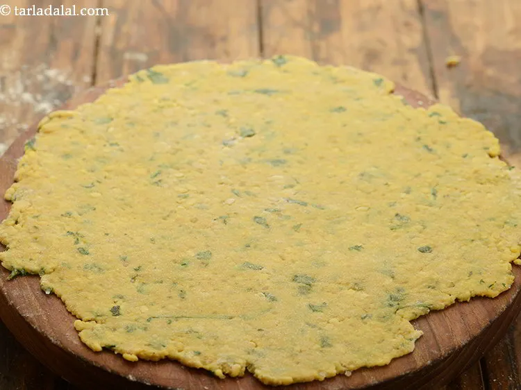 Step 20 – To prepare <strong>moong dal namak para</strong>, take a portion and cover the other to prevent …