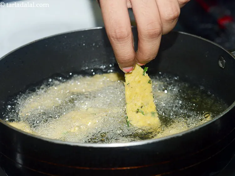 Step 25 – For frying, <strong>moong dal namak pare</strong> heat the oil in a deep non-stick kadhai and …