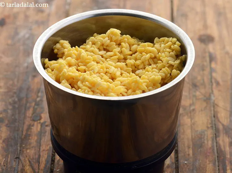 Step 5 – After half an hour, drain the moong dal and transfer to a mixer jar.