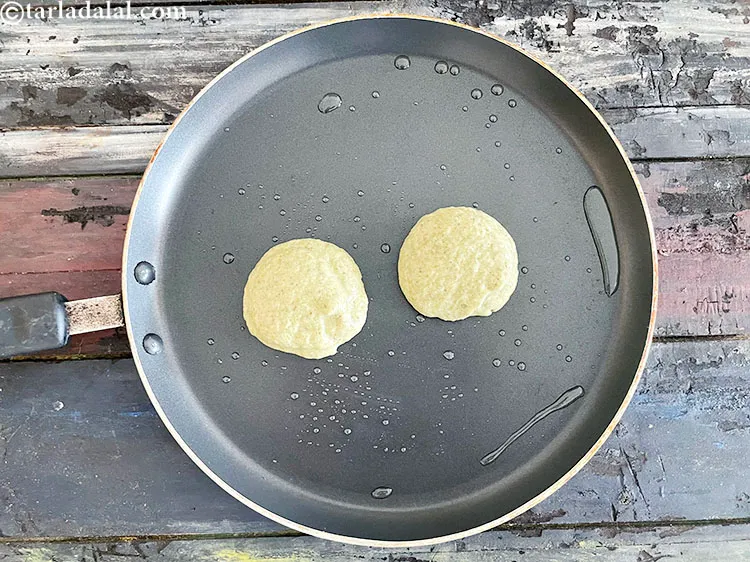 Step 27 – Pour ladlefuls of the batter on it to make 2 to 4 vadas at a …