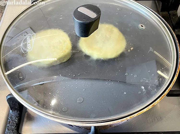 Step 30 – Cover again and cook on a slow flame using 1/8 tsp of oil for 2 …