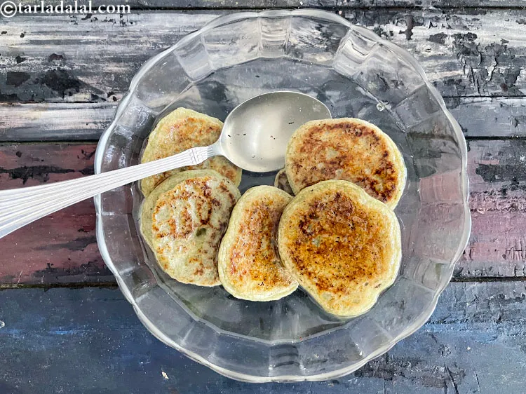 Step 34 – After one minute of soaking flip the vadas over with a spoon to get uniform …