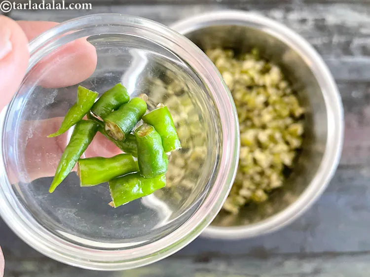 Step 15 – Add&nbsp;<meta charset="UTF-8" />2&nbsp;<a href="glossary-green-chillies-331i">green chillies</a>&nbsp;, roughly chopped.