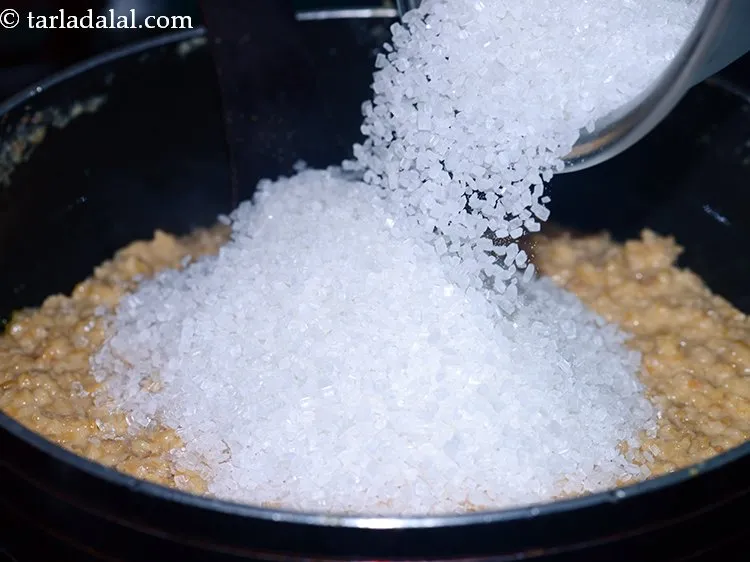 Step 17 – Add sugar. Instead of sugar, you can also use jaggery for a healthier option.