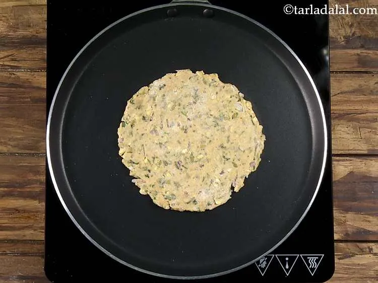 Step 19 – Heat a non-stick tava (griddle) and place a&nbsp;<strong>green moong dal paratha | moong dal paratha …