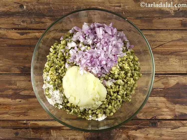 Step 7 – To this, add the finely chopped onions. Make sure the onions are very finely chopped …