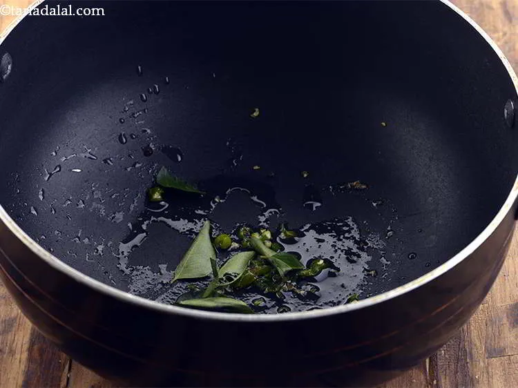 Step 13 – Add the curry leaves and saut&eacute; on a medium flame for a few seconds.