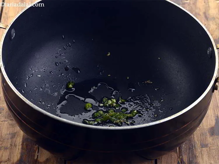 Step 12 – Now add the green chillies to spice up the <strong>Moong soup</strong>.