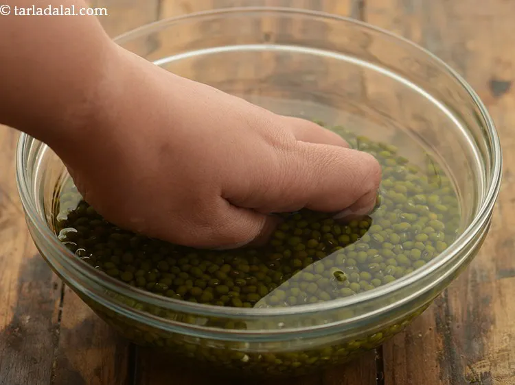 Step 5 – Wash it very well with enough water. Click here for detailed recipe of<strong><a href="https://www.tarladalal.com/how-to-sprout-moong-mung-beans-40323r" target="_blank"> …
