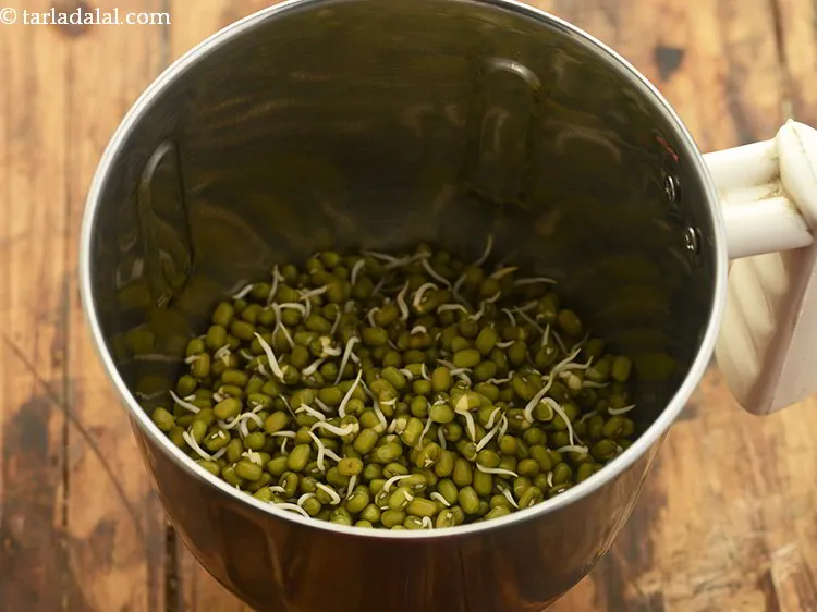 Step 8 – Place the moong sprouts in a mixer jar.