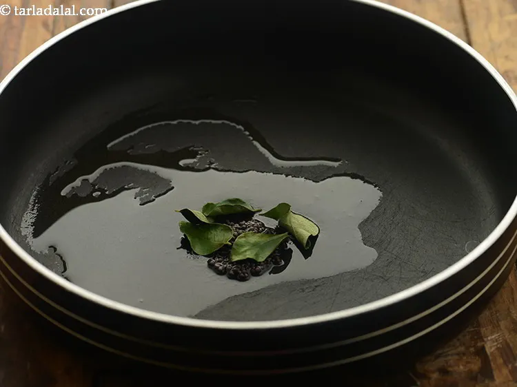 Step 18 – Add the curry leaves.